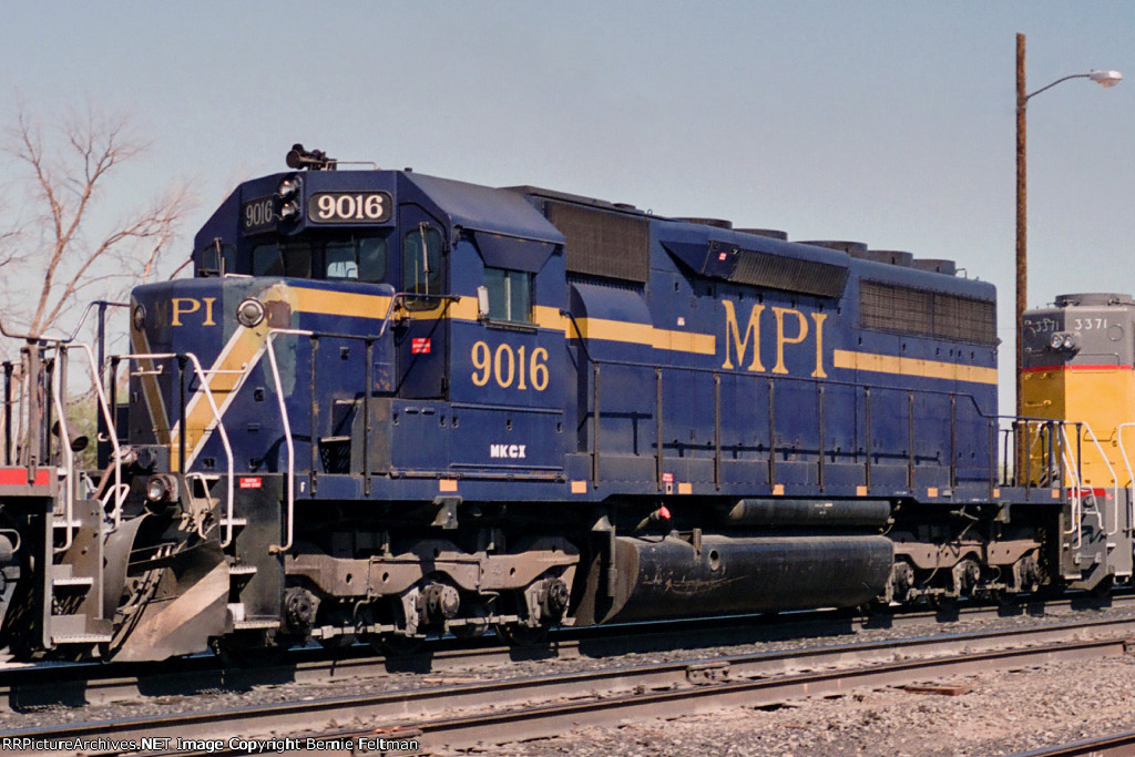 MPI SD40M-2 #9016 in an eastbound consist passing the historic depot